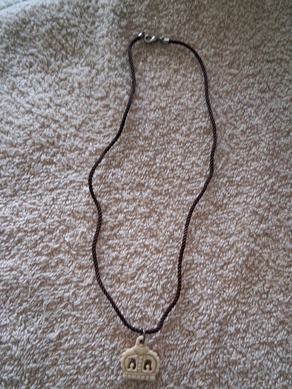 Crown Charm Necklace in Cream on Brown Cord